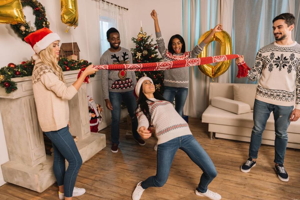 multiethnic friends playing limbo game