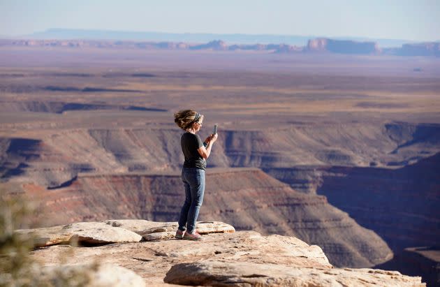 A visitor photographs a vista at Bears Ears National Monument on April 4, 2021, outside Blanding, Utah. (Photo: George Frey/Getty Images)