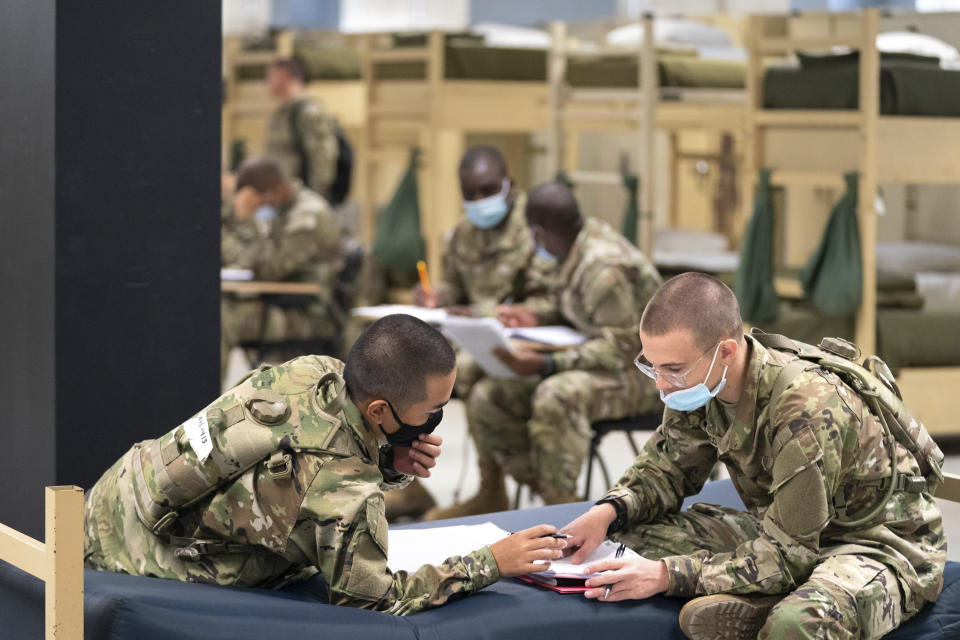 Students enlisted in the new Army prep course work together in barracks at Fort Jackson in Columbia, S.C., Friday, Aug. 26, 2022. The new course is an an effort to better prepare recruits for the demands of basic training. (AP Photo/Sean Rayford)