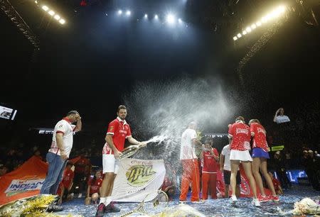 Tennis - International Premier Tennis League - Singapore Indoor Stadium, Singapore - 20/12/15 International Premier Tennis League Final Stan Wawrinka sprays champagne with members of the Singapore Slammers after winning the final Action Images via Reuters / Jeremy Lee Livepic