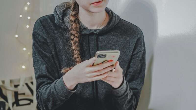 Teen girl on her smartphone