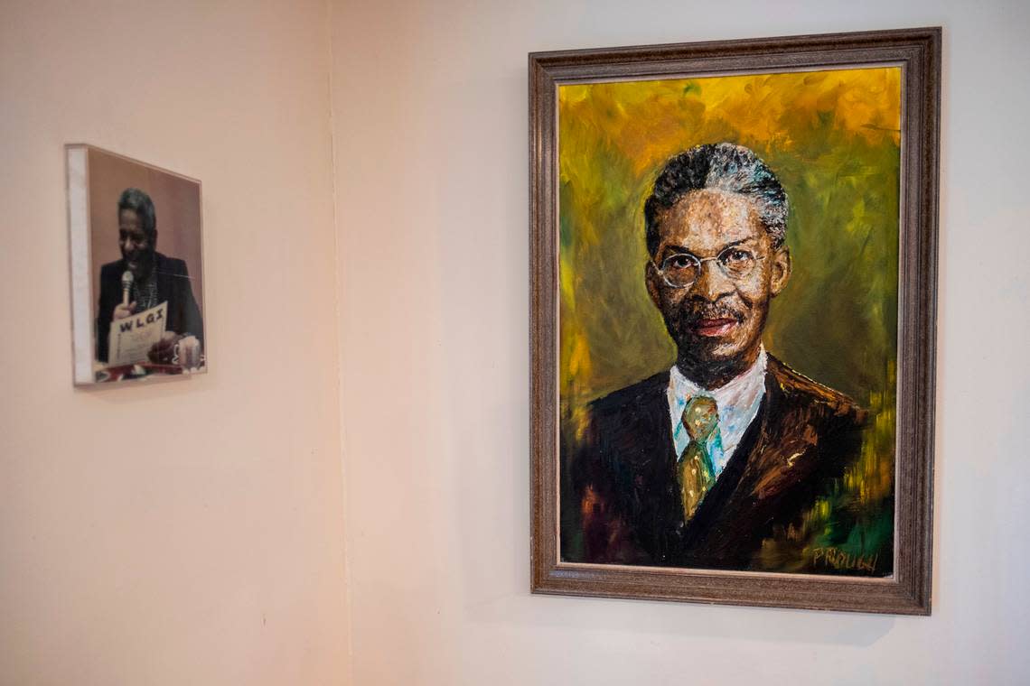 A painting of Louis G. Gregory, first Baha’i from South Carolina, along with a photo of jazz musician Dizzy Gillespie visiting Hemingway decorate the walls of Radio Baha’i.. March 8, 2023.