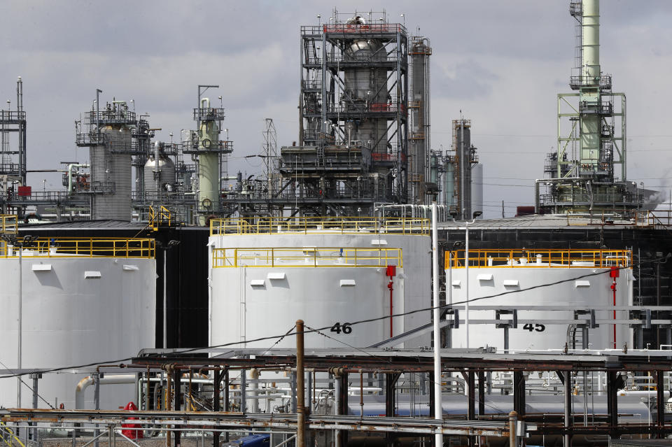 FILE - Storage tanks are shown at a refinery in Detroit, Tuesday, April 21, 2020. The White House on Tuesday said it had ordered 50 million barrels of oil released from strategic reserve to bring down energy costs. (AP Photo/Paul Sancya, File)