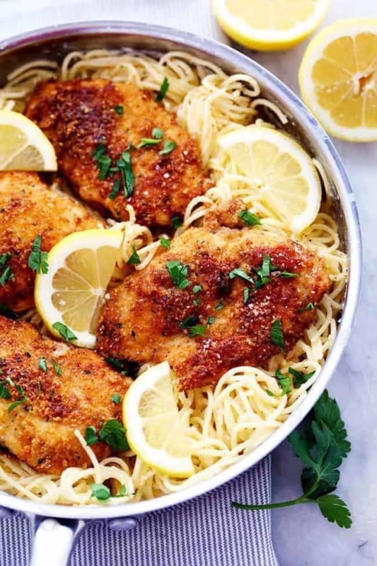 The Recipe Critic<p>Crispy, tender and juicy parmesan crusted chicken over the most incredible creamy lemon garlic pasta! This is a must make meal!</p><p><strong>Get the recipe: <a href="https://therecipecritic.com/crispy-parmesan-chicken-with-creamy-lemon-garlic-pasta/" rel="sponsored" target="_blank" data-ylk="slk:Crispy Parmesan Chicken with Creamy Lemon Garlic Pasta;elm:context_link;itc:0;sec:content-canvas" class="link "><em>Crispy Parmesan Chicken with Creamy Lemon Garlic Pasta</em></a></strong></p>