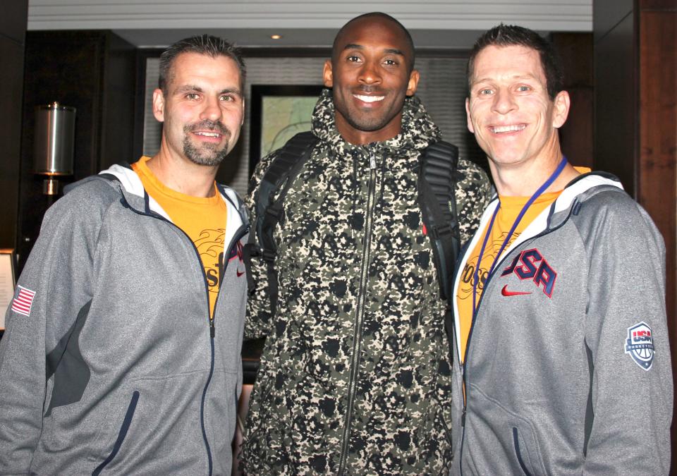 Crossfire Ministries co-founders Randy Shepherd, left, and Jamie Johnson, right, pose with NBA Hall of Famer Kobe Bryant.