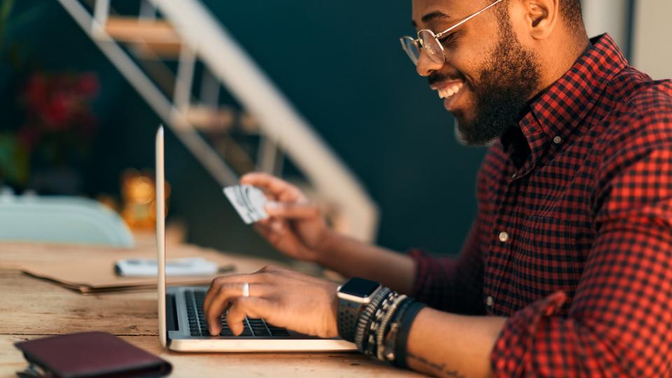 Young millennial using technology and buying on line.