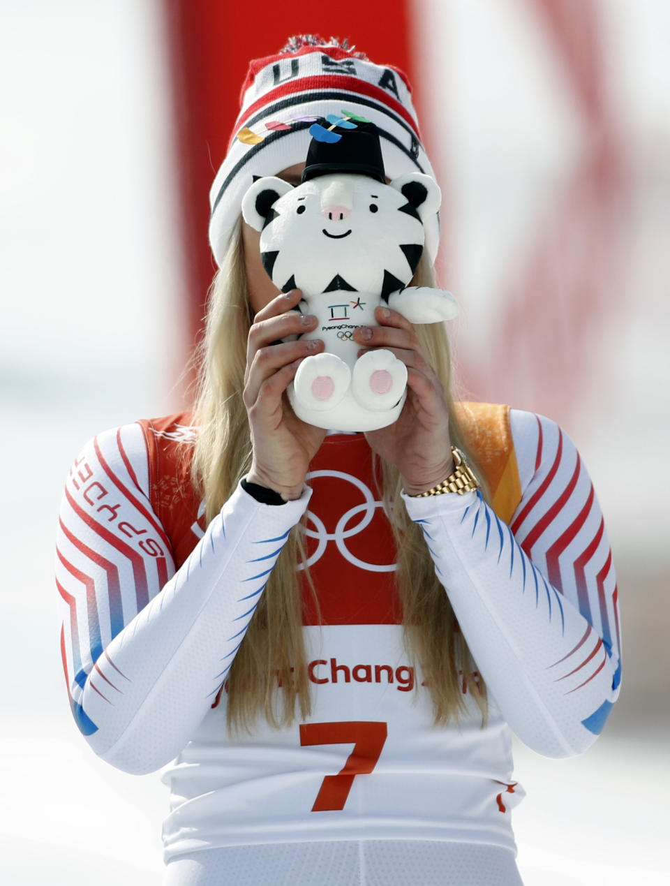 <p>Bronze medal winner Lindsey Vonn, of the United States, playfully places a stuffed Olympic mascot over her face as she celebrates during the flower ceremony for the women’s downhill at the 2018 Winter Olympics in Jeongseon, South Korea, Wednesday, Feb. 21, 2018.(AP Photo/Christophe Ena) </p>