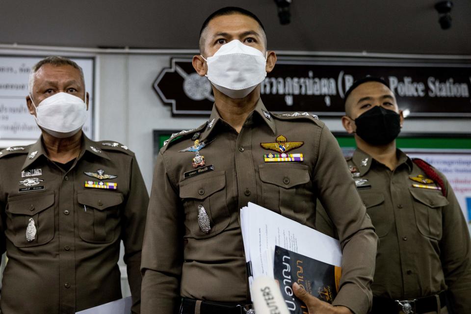 A police officer, pictured here delivering a short statement to the press at Bophut police station after Shane Warne's death.