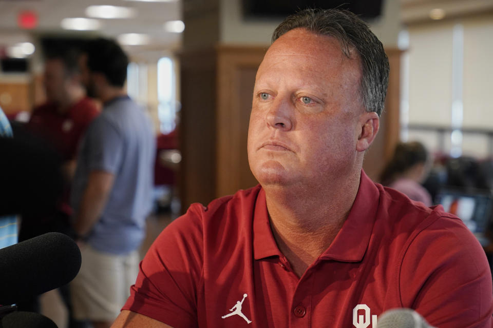 Oklahoma offensive coach Cale Gundy speaks during an NCAA college football media day, Tuesday, Aug. 2, 2022, in Norman, Okla. Gundy announced his resignation Sunday, Aug. 7, after using offensive language during a film session the week prior. (AP Photo/Sue Ogrocki)