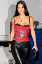 <p>Kim Kardashian wore a red snakeskin top and leather pants for a late-night dinner in Los Angeles.</p>