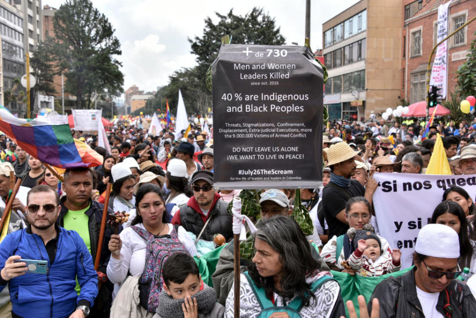 Anti-government demonstrators holding signs during national strike on Nov. 21, 2019 in Bogota, Colombia. | Guillermo Legaria Schweizer—Getty Images