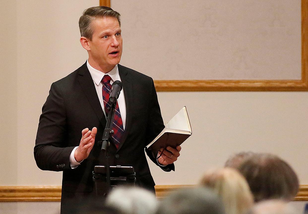 Kevin McClain prays for military veterans at the Ashland County Ministerial Association's prayer breakfast celebrating National Day of Prayer in this May 5, 2022 photo.