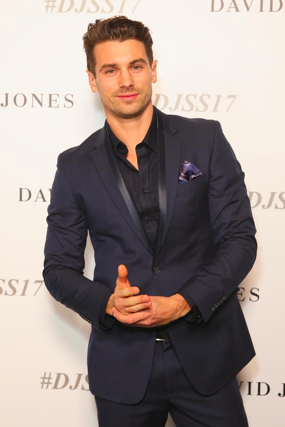 Bachelor babe Matty J looking smoking in a deep blue suit. Photo: Getty