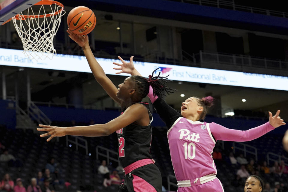 North Carolina State guard Saniya Rivers (22) lays the ball up against Pittsburgh guard Bella Perkins (10) during the first half of an NCAA college basketball game Sunday, Feb. 11, 2024, in Pittsburgh. (AP Photo/Matt Freed)