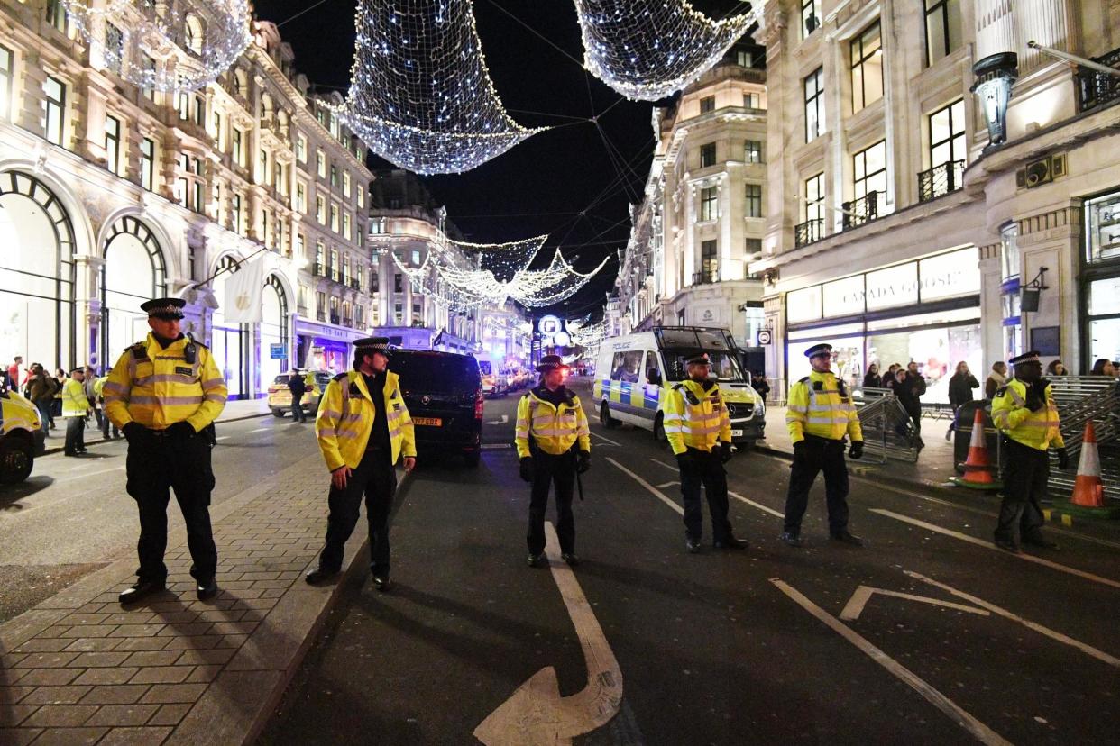 Police at the scene on Oxford Street on Friday evening: EPA