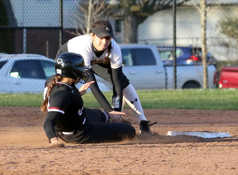 Corning shortstop Atalyia Rijo tags out Elmira's Delaney Williams at second base during the Hawks' 12-4 win in softball April 21, 2022 at Corning-Painted Post High School.