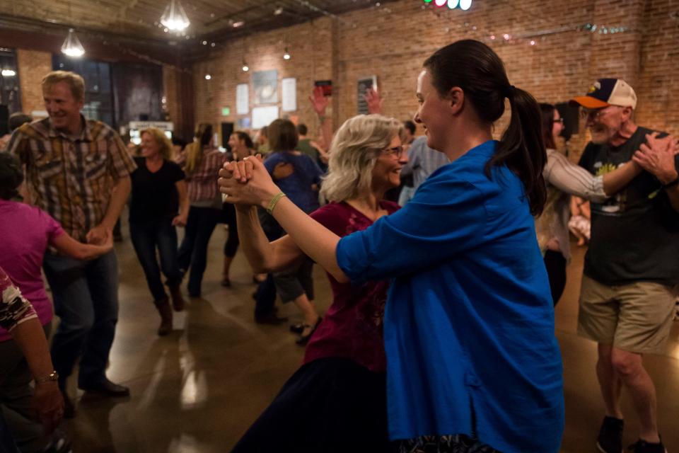 In this file photo, participants dance during CROMA Barn Dance's performance at Everyday Joe's during FoCoMX on Saturday, April 28, 2018, in Fort Collins.