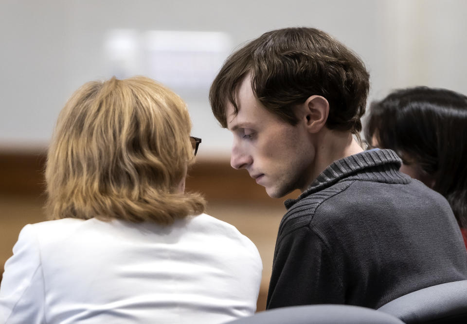 Logan Clegg looks down as he listens to defense attorney Caroline Smith at Merrimack County Superior Court in Concord, N.H. on Monday, October 23, 2023 . After deliberating for a day and a half, a jury found Clegg guilty of second-degree murder in the April 2022 killings of Stephen and Djeswende Reid. (Geoff Forester/The Concord Monitor via AP, Pool)