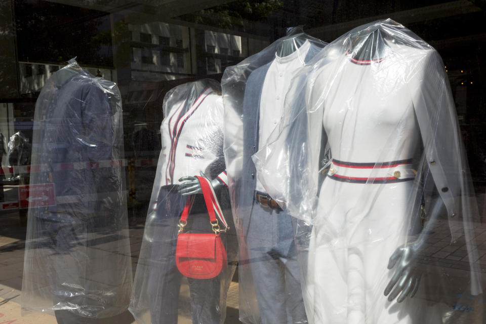 As the UK's Coronavirus death toll during the government's social distancing lockdown, rose by 384 to 33,998, and the R rate of infection is reported to be between 0.7 and 1.0, clothing mannequins in the window of a closed branch of Ted Baker, are covered in polythene plastic, in a deserted City of London, the capital's financial district, on 15th May 2020, in London, England. (Photo by Richard Baker / In Pictures via Getty Images)