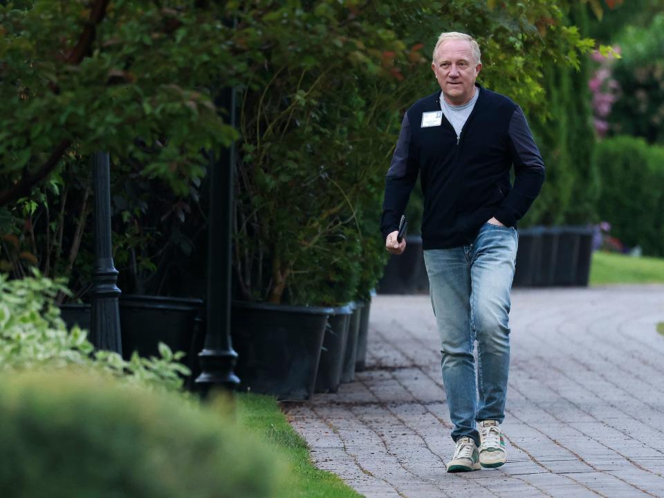 Francois-Henri Pinault, Kering CEO, walks on sidewalk at Sun Valley resort