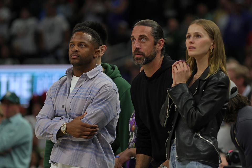 Green Bay Packers players Randall Cobb, left, and Aaron Rodgers and Mallory Edens, the daughter of Milwaukee Bucks owner Wes Edens, watch Game 2 between the Milwaukee Bucks and Chicago Bulls at Fiserv Forum in April 2022.