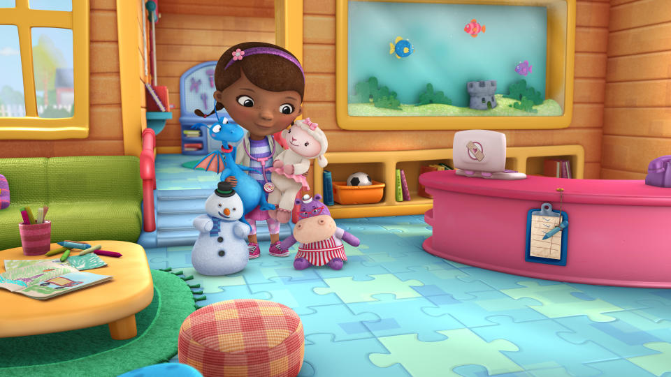 In this image released by Disney Junior, the character Doc McStuffins is shown with her stuffed animal friends, from left, Chilly, Stuff, Lambie and Hallie in a scene from Disney Junior's animated series "Doc McStuffins." The show, about a six-year-old girl who runs and operates a clinic for broken toys and worn out stuffed animals out of the playhouse in her backyard, will debut Friday, March 23, on the new 24-hour Disney Junior channel. (AP Photo/Disney Junior)