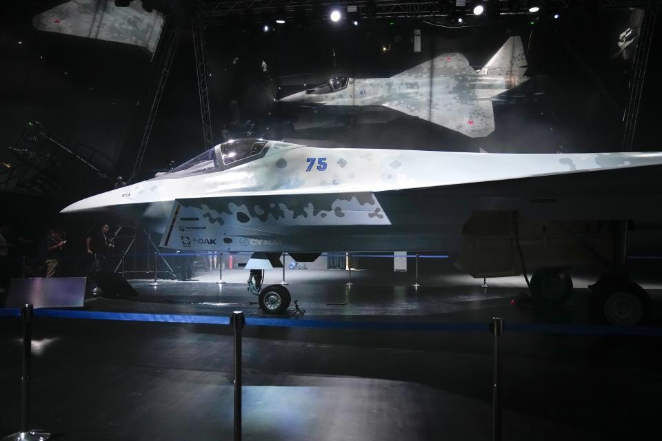 A prototype of Russia's prospective fighter jet is displayed at the MAKS-2021 International Aviation and Space Salon in Zhukovsky outside Zhukovsky, Russia, Tuesday, July 20, 2021. Russia has presented a prototype of a new fighter jet that features stealth capabilities and other advanced characteristics and will be offered to foreign customers. Russian President Vladimir Putin inspected the new warplane displayed at the MAKS-2021 International Aviation and Space Salon. (AP Photo/Alexander Zemlianichenko, Pool)