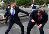 US Presidential candidate Mitt Romney impersonator Mike Cote (R) "fights" with US President Barack Obama impersonator Reggie Brown during an Obama vs Romney "showdown" in Washington Square Park in New York on September 05, 2012. AFP PHOTO/Emmanuel Dunand