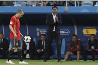 <p>Head coach Fernando Hierro watches on as Spain’s Andres Iniesta controls the ball </p>