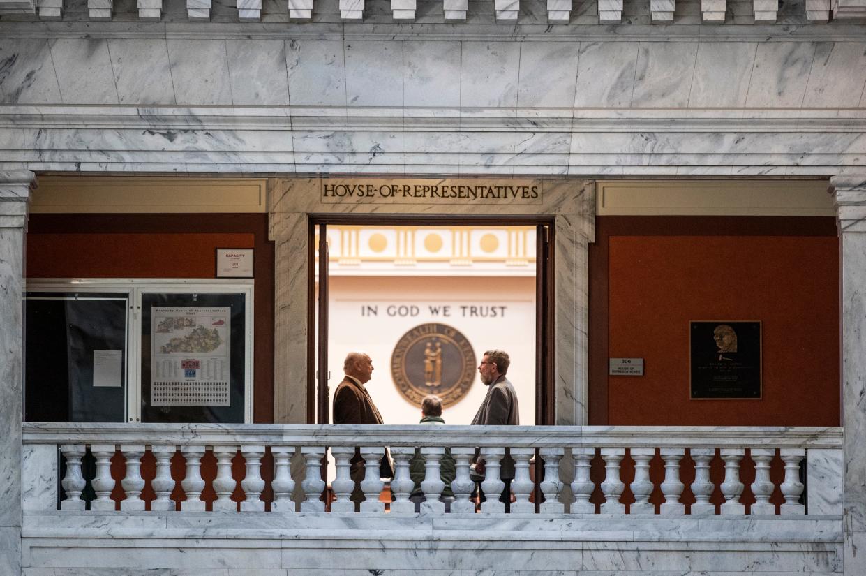 Two men speak in the entrance to the House of Representatives as the Kentucky state legislature opened its 2022 session in Frankfort on Jan 4, 2022.