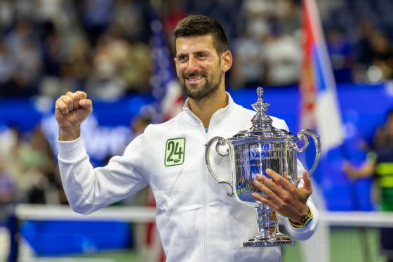 Djokovic holds the U.S. Open winners’ trophy after claiming his 24th major title at the Billie Jean King National Tennis Center’s Arthur Ashe Stadium in Flushing, Queens, on Sunday.<span class="copyright">Tim Clayton—Corbis/Getty Images</span>