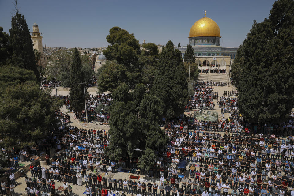 Palestinian worshipers pray during the first Friday of the holy month of Ramadan at the Al Aqsa Mosque compound in Jerusalem's old city, Friday, April. 16, 2021. (AP Photo/Mahmoud Illean)