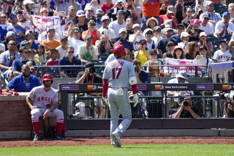 Los Angeles Angels designated hitter Shohei Ohtani returns to the dugout after striking out during the eighth inning of a baseball game against the New York Mets, Sunday, Aug. 27, 2023, in New York. (AP Photo/Mary Altaffer)