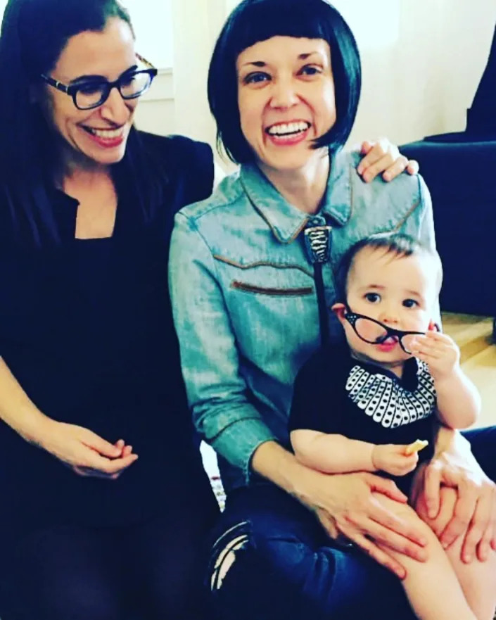 Fatma Marouf (left), Bryn Esplin (right), and their daughter at home in Fort Worth, Texas.