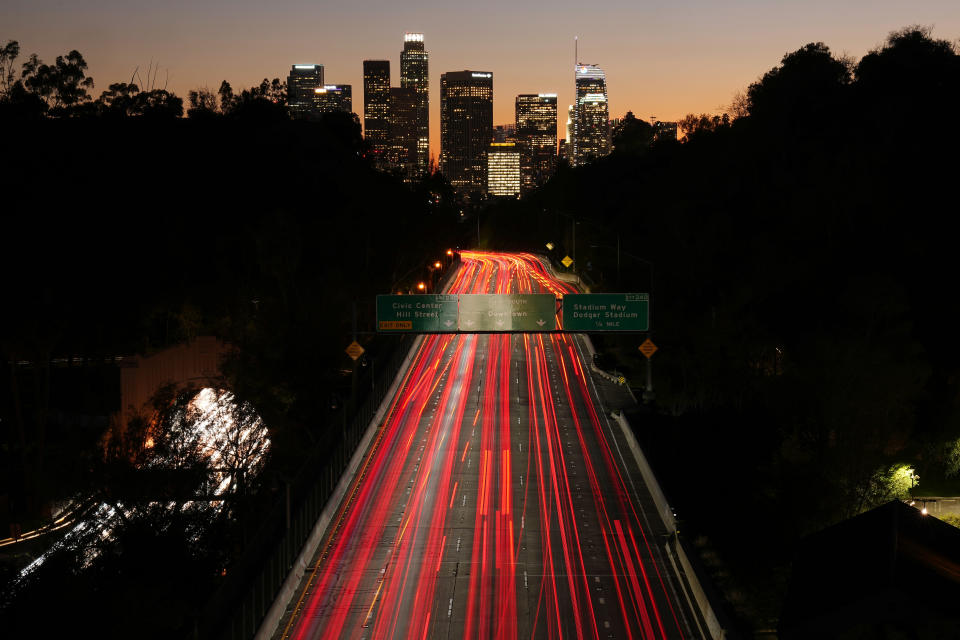 FILE - Traffic on the 110 freeway heads toward downtown Los Angeles in this long exposure photograph Friday, Jan. 27, 2023. The failure of several large lenders in early 2023 and the banking turmoil that followed have fueled worries for owners of office space. (AP Photo/Mark J. Terrill, File)