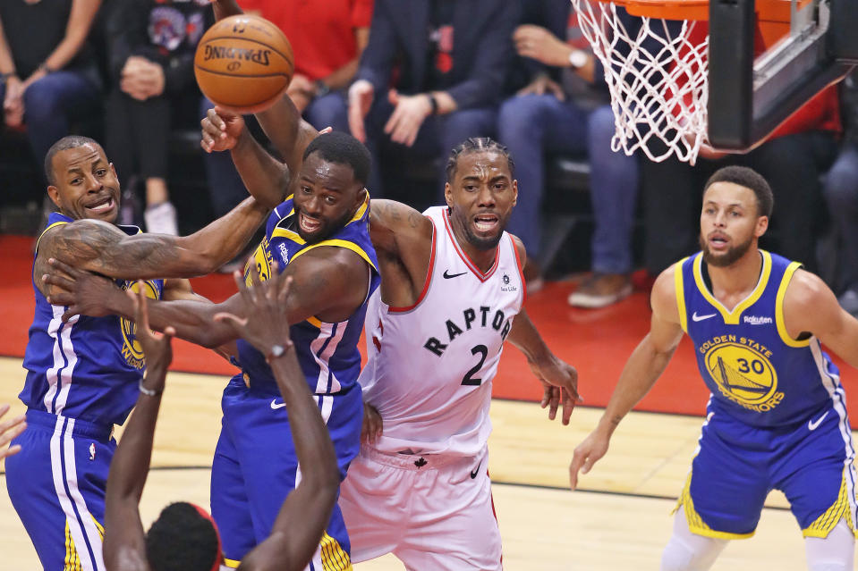 TORONTO,ONTARIO - JUNE 10:  Andre Iguodala #9 and Draymond Green #23 of the Golden State Warriors battle against Kawhi Leonard #2 of the Toronto Raptors during Game Five of the 2019 NBA Finals at Scotiabank Arena on June 10, 2019 in Toronto, Canada. NOTE TO USER: User expressly acknowledges and agrees that, by downloading and or using this photograph, User is consenting to the terms and conditions of the Getty Images License Agreement. (Photo by Claus Andersen/Getty Images)