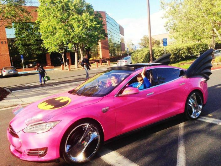 sergey brin driving a pink tesla