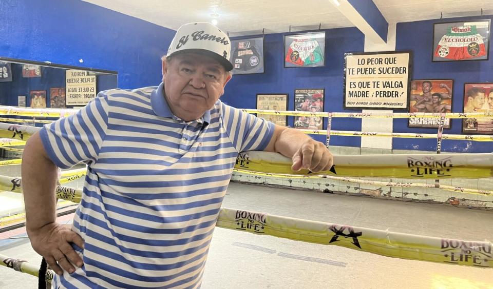 Man stand by boxing ring