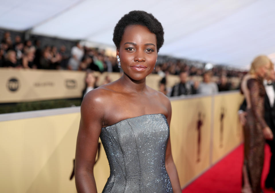 <p>Vernon François is one of Lupita’s go-to stylists, and he certainly didn’t disappoint by adding beautiful shape to Lupita’s close-cut Afro. To re-create Lupita’s look, he prepperd her hair with Vernon François Leave-In Conditioner and finished by contouring and sculpting her hair into a side quiff using U-pins to secure. (Photo: Getty Images) </p>