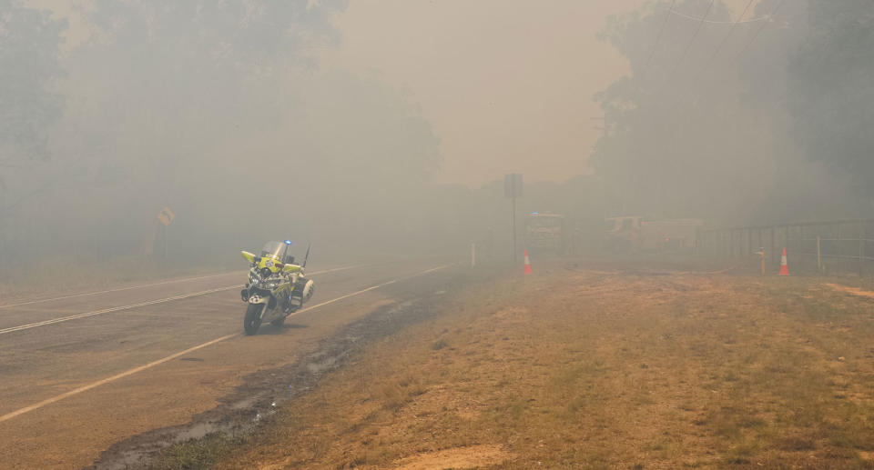 Thick haze created by devastating bushfire in Cooroibah in Queensland that destroyed a family home.