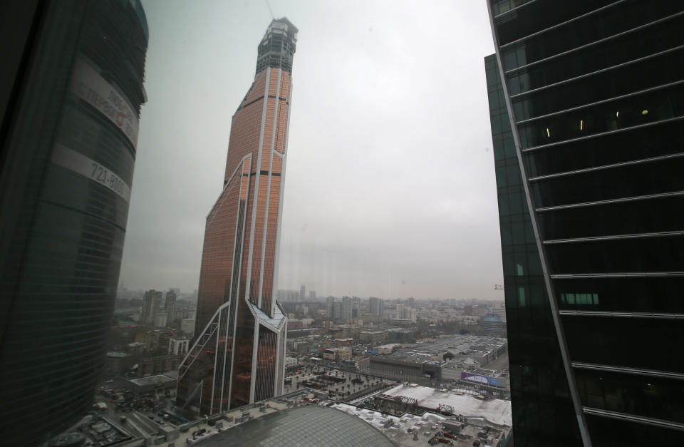 The Mercury City tower, center, is being constructed in Moscow, Russia, Thursday, Nov. 1, 2012. Moscow is reclaiming bragging rights for having Europe’s tallest building after losing the distinction for a few months to London. The mixed office and residential tower called Mercury City has topped out at 338 meters (1,109 feet), officials of its development company said Thursday. (AP photo / Mikhail Metzel)