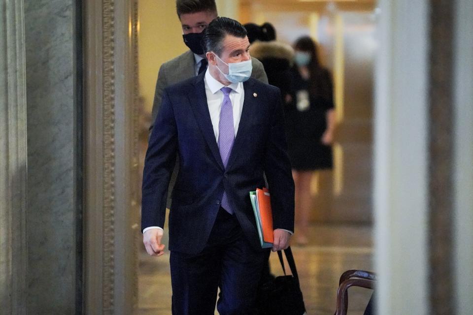 U.S. Senator Todd Young (R-IN) arrives to the Senate Chamber for the fifth day of the impeachment trial of former President Trump in Washington, U.S., February 13, 2021. Greg Nash/Pool via REUTERS