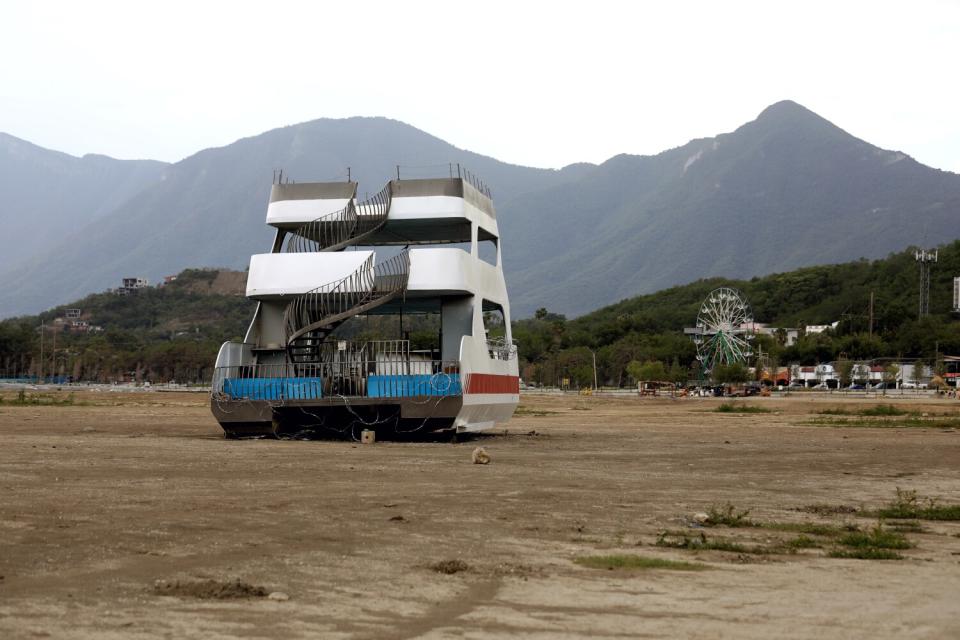 A boat is stranded on ground where water would normally be.