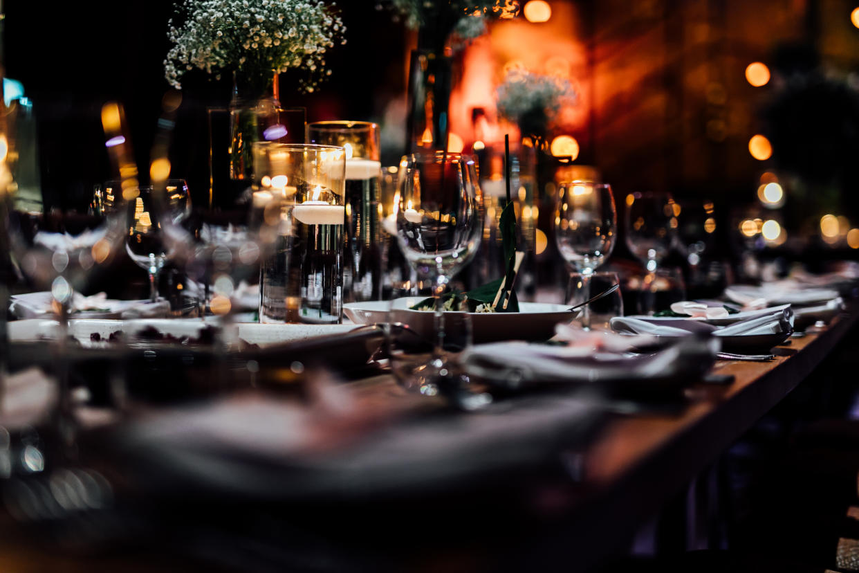  Table setting with wine glasses and candles. 