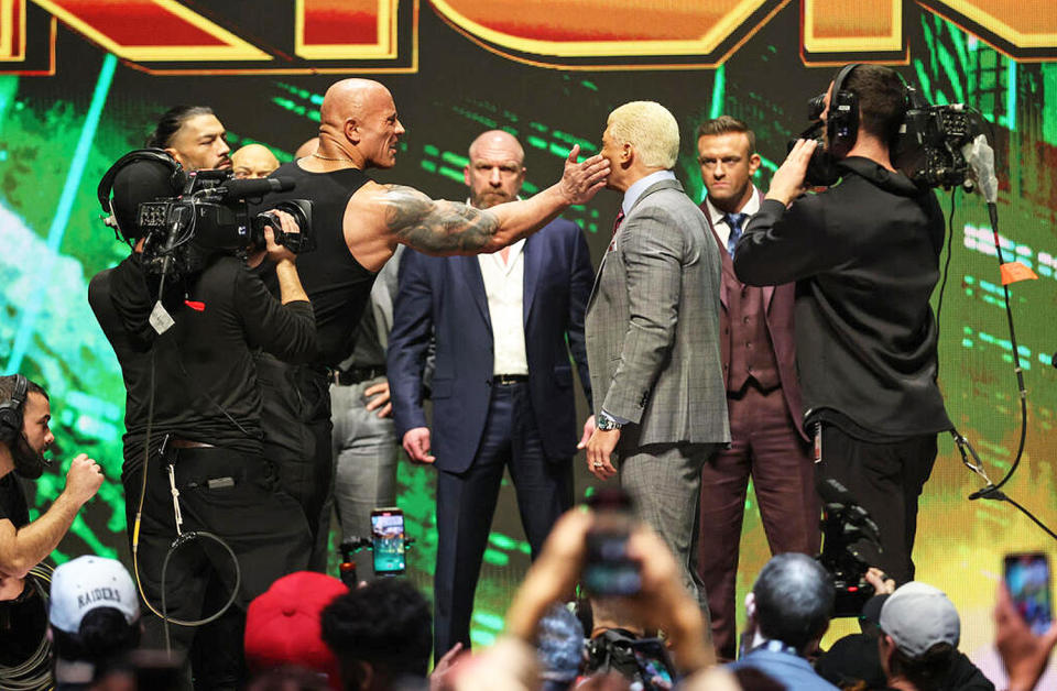 The Rock slaps Cody Rhodes at WrestleMania 40 kickoff event in Las Vegas. (Courtesy WWE)