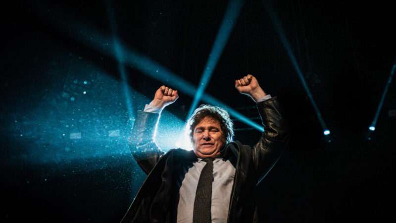 Presidential candidate of the Liberty Advances coalition Javier Milei waves to supporters during a campaign rally.