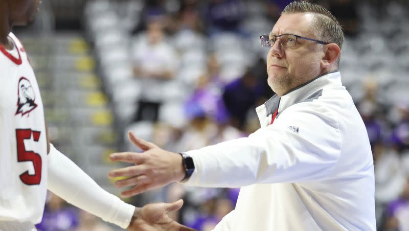 Southern Utah head coach Todd Simon greets Tevian Jones (55) at the bench during the first half of an NCAA college basketball game against Grand Canyon in the championship of the Western Athletic Conference tournament Saturday, March 11, 2023, in Las Vegas. Grand Canyon won 84-66. 