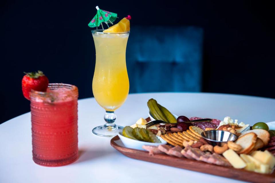 The Fire Bird Margarita, left, the Bird of Paradise, and the small charcuterie board at the Hen House, which serves drinks and small bites, in Bay St. Louis on Wednesday, May 29, 2024.