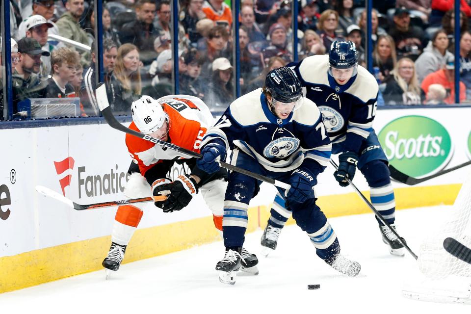 Apr 6, 2024; Columbus, Ohio, USA; Columbus Blue Jackets defenseman Nick Blankenburg (77) and Philadelphia Flyers left wing Joel Farabee (86) battle for control of the puck during the third period at Nationwide Arena. Mandatory Credit: Russell LaBounty-USA TODAY Sports