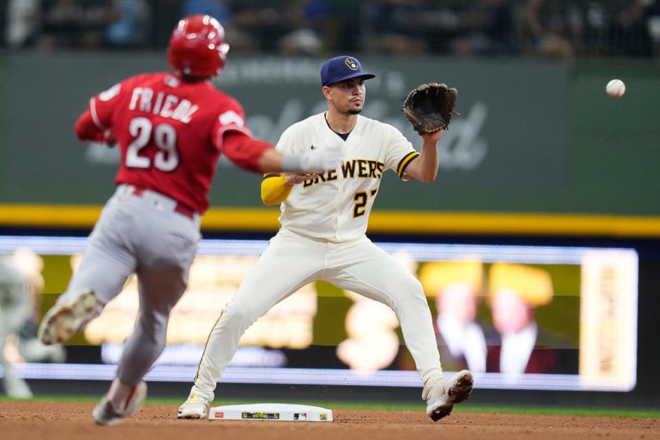 Milwaukee Brewers shortstop Willy Adames (27) takes out Cincinnati Reds center fielder TJ Friedl (29) on second during the fourth inning of the game on Wednesday July 26, 2023 at American Family Field in Milwaukee, Wis.
